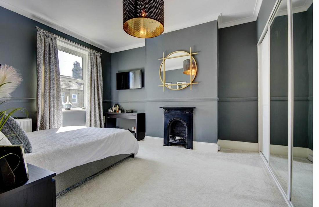 Master Bedroom with Cast-Iron Fireplace